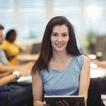 Portrait of woman holding digital tablet