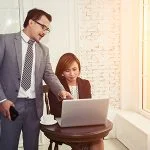 Horizontal view of boss talking at employee