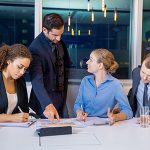 Businessman Discussing Business with Team