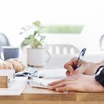 Man Writing Document Dinning Table Concept